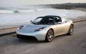 Caption: Unleashing The Future - Tesla Roadster Wallpaper