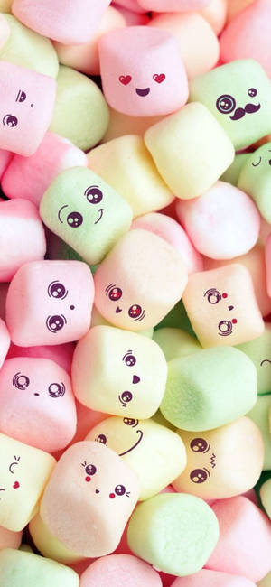 Caption: Whimsical Marshmallow Faces On Pastel Background Wallpaper