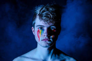 Caption: Young Man Showcasing Pride Makeup Wallpaper