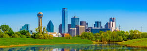 Captivating Dallas Skyline By Night Wallpaper