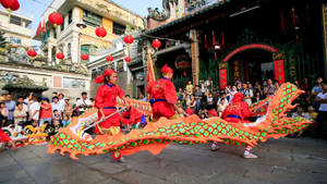 Captivating Dragon Dance Performance In Ho Chi Minh City Wallpaper
