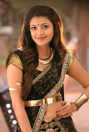 Captivating Kajal Agarwal In Glittering Golden Attire Wallpaper