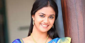 Captivating Keerthi Suresh In An Elegant Blue And Yellow Sari Wallpaper