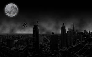 Captivating View Of Darkened City Under The Moon Wallpaper