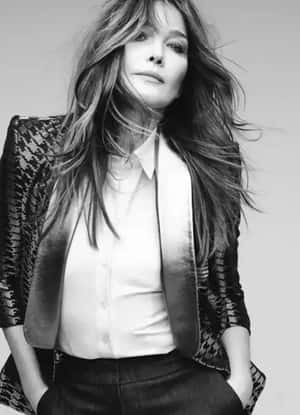 Carla Bruni Elegantly Strumming Guitar Wallpaper