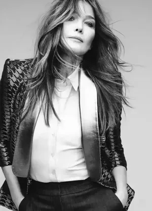 Carla Bruni Elegantly Strumming Guitar Wallpaper