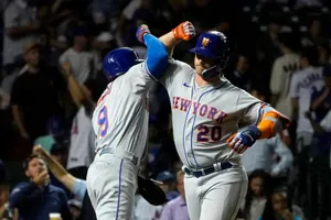 Carlos Carrasco Bumping With Teammate Wallpaper