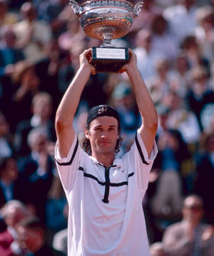 Carlos Moya Presenting Trophy Wallpaper