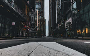 Cars Line Up On An Urban Street Wallpaper