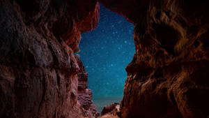 Cave Under Starry Sky Wallpaper