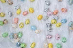 Celebrate The Joy Of Easter With Colorful Tiny Assorted Easter Eggs Wallpaper