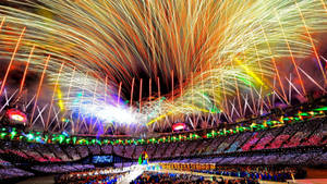 Celebrate The Olympians In A Brilliant Display Of Fireworks Wallpaper