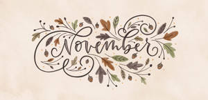 Celebrate The Season Of November With Autumn Calligraphy Art Wallpaper