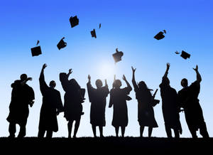 Celebrating Freedom: Graduation Cap Toss Wallpaper