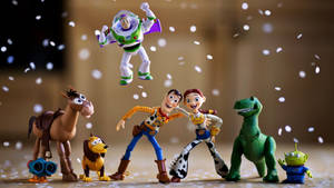 Celebratory Moment With Buzz Lightyear And Friends Wallpaper