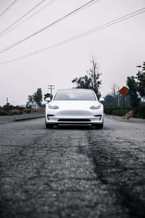 Charge Your Iphone With A Tesla Powerbank Wallpaper