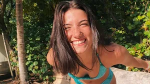 Charli And Addison In Their High School Volleyball Game Wallpaper