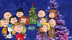 Charlie Brown And The Gang Enjoying A Christmas Eve Complete With A Tree And Presents! Wallpaper