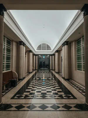 Checkered Floor Of Empty Hallway Wallpaper