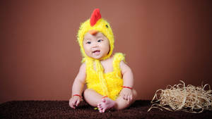 Child In Yellow Chick Mascot Wallpaper