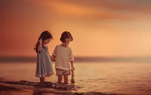 Children Taking A Dip In The Water Wallpaper
