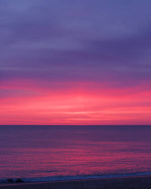 Chill Pink Sunset By Beach Wallpaper