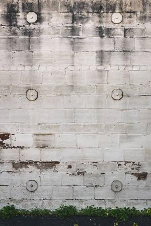 Chiseled White Brick Wall With Bolts Wallpaper