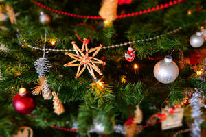 Christmas Tree With Festive Decorations Wallpaper