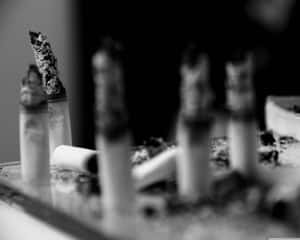 Cigarette Ash On A Table Wallpaper