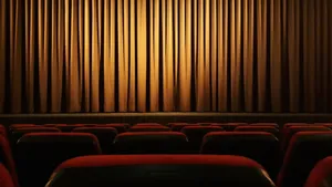 Cinema_ Theater_ Interior_with_ Curtains_and_ Seats Wallpaper