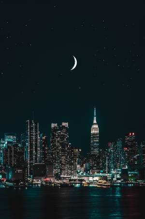 City Lights And Crescent Moon Wallpaper
