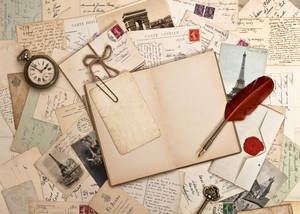 Classic Letters, Notebook, And Feather Pen Wallpaper