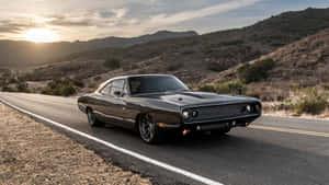 Classic Muscle Car Sunset Road Wallpaper