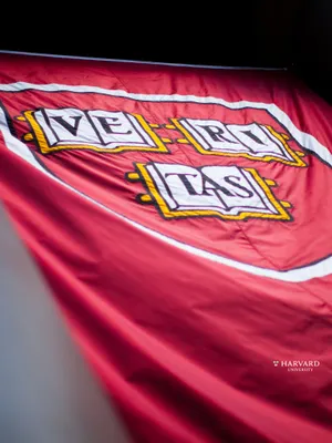 Classic View Of Harvard University Red Motto Wallpaper