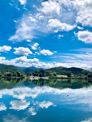 Clear Blue Sky By The Lake Wallpaper