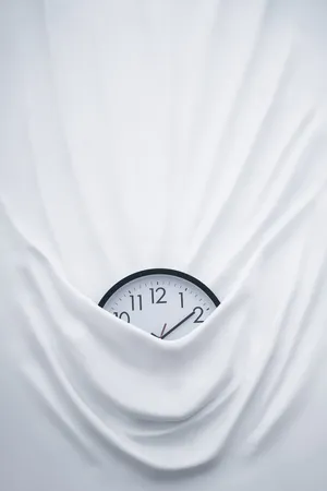 Clock On Bed Sheets Wallpaper