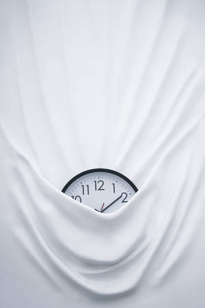 Clock On Bed Sheets Wallpaper