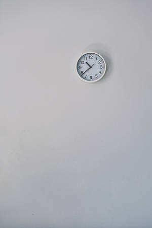 Clock On White Wall Wallpaper