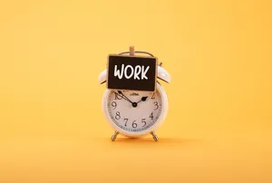 Clock On Yellow Backdrop Wallpaper