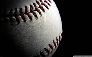 Close-up Baseball In Dark Wallpaper