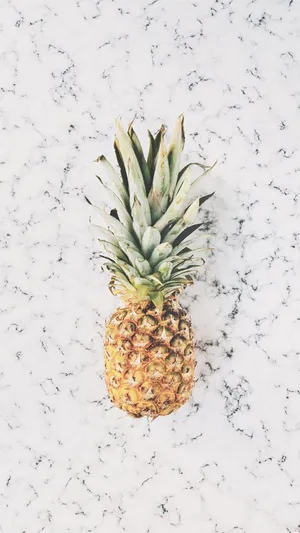 Close-up Of Pineapple Against A Marble Background Wallpaper