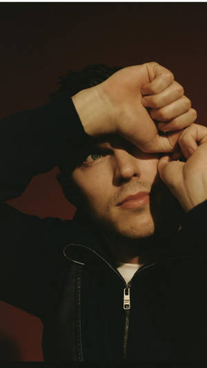 Close-up Shot Of Nicholas Hoult Covering One Eye With Hand. Wallpaper