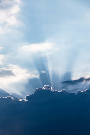 Clouds With Sun Rays Aesthetic Light Blue Wallpaper
