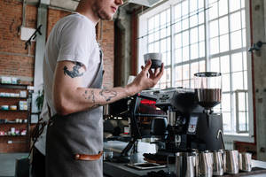 Coffee Shop Employee With Tattoos Wallpaper