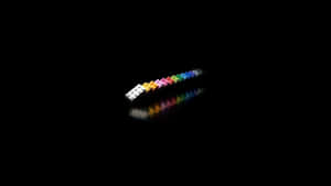 Colorful Dominoeson Black Background Wallpaper