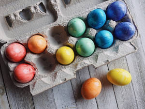 Colorful Easter Eggs On Egg Tray Wallpaper