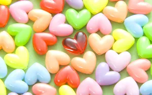 Colorful Hearts On Green Table Wallpaper