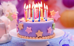 Colorful Stars Birthday Cake Candles Wallpaper