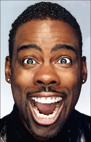 Comedian Chris Rock Making A Funny Face Wallpaper