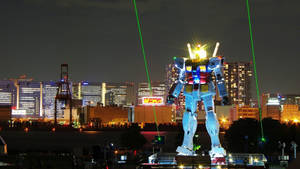 Commemorating Japan's Robotic Culture - The Gundam Statue In Tokyo Wallpaper